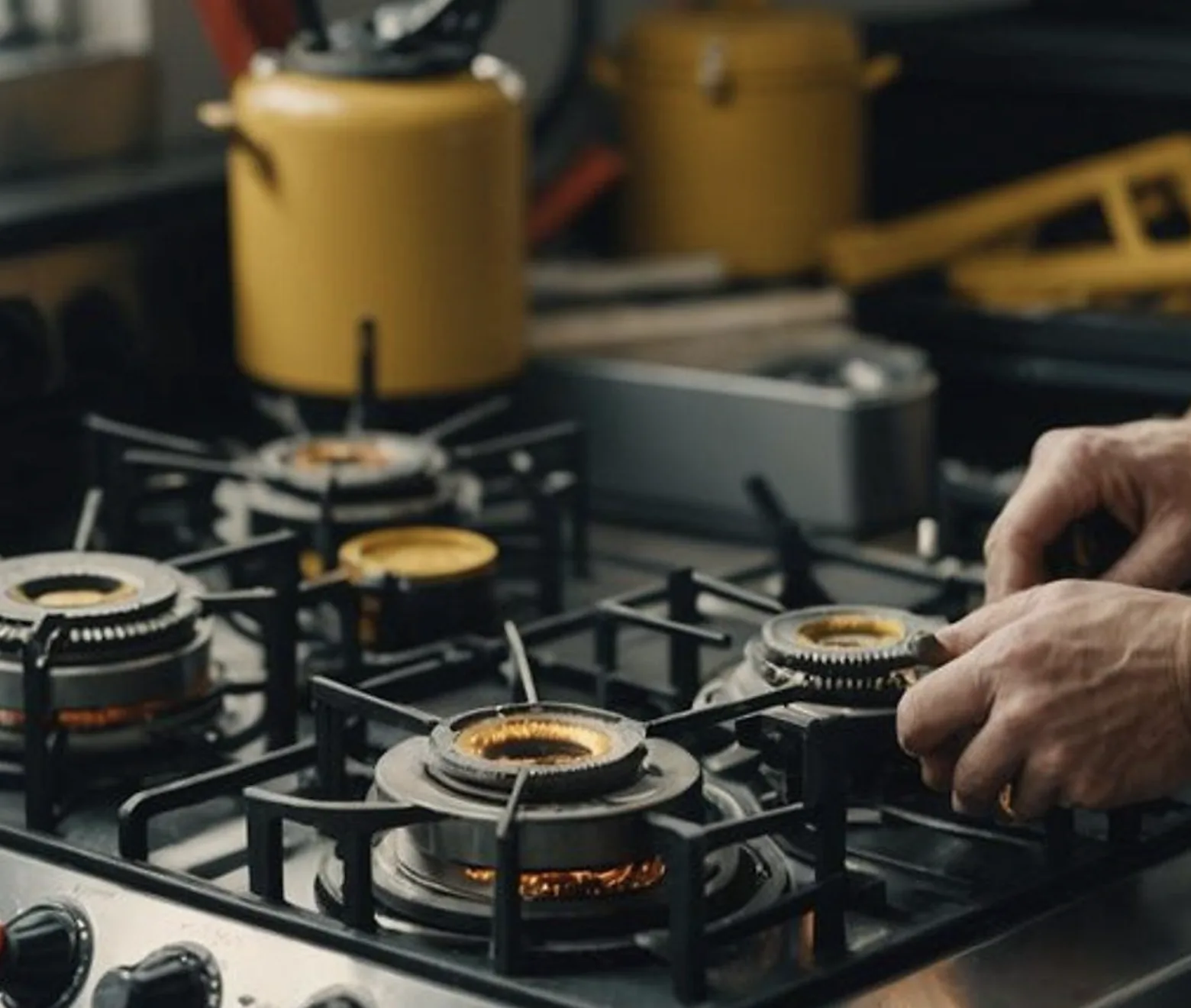 Technician servicing a gas stove burner